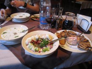 Tarator soup, shopska salad, bread with fish roe spread, and jug of wine in Veliko Tarnovo