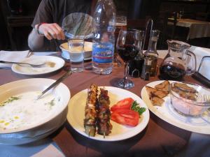 Tarator soup, skewers of pork and chicken with tomatoes, bread with fish roe spread and jug of wine in Veliko Tarnovo