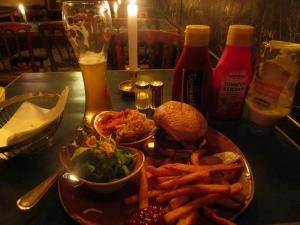 Burger with both sweet potato and regular wedge fries, a small salad, and some sauerkraut - Berlin