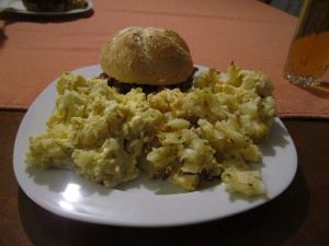 Pulled pork sandwich, macaroni & cheese, and potato salad