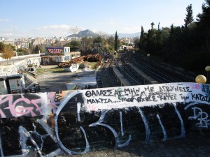 Graffiti over railroad tracks in Athens