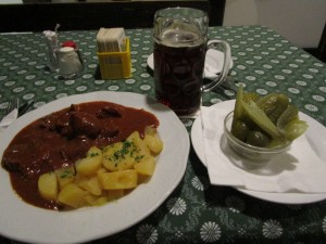 Goulash, salted potatoes and pickles